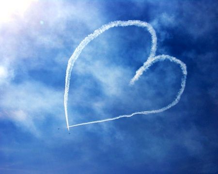 Airplanes skywriting a heart