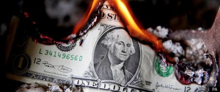 image of a burning dollar bill