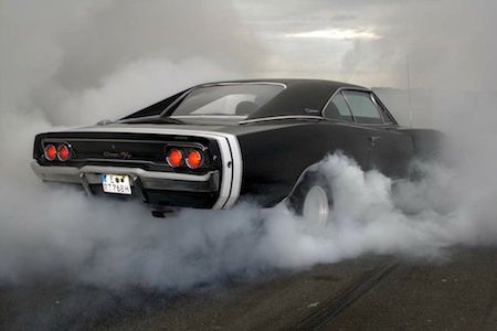 A 1968 Dodge Charger doing a burnout