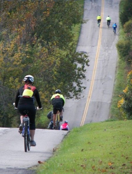 People biking down a very steep hill