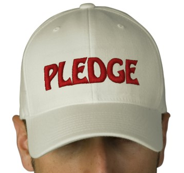 A person wearing a literal cap that says 'pledge'