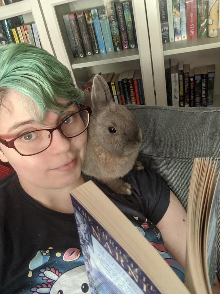 Nicky and a bunny (Biscuit) reading a book